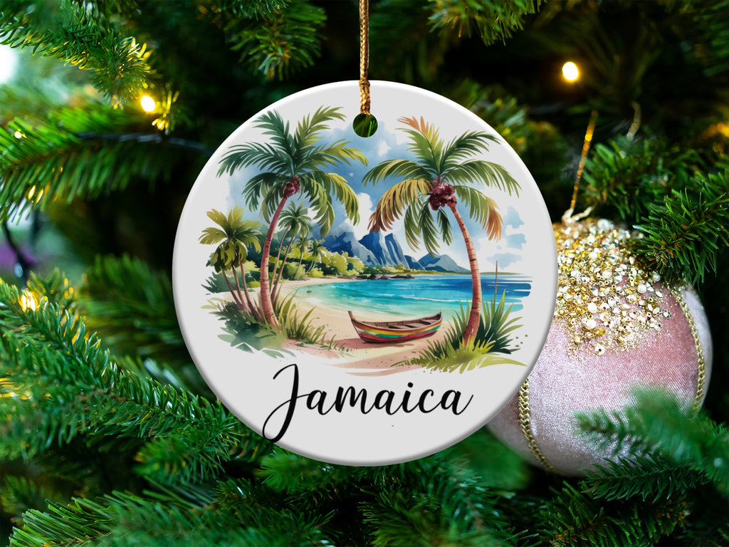 Round ornament with beach scene and "Jamaica" text hangs on a Christmas tree.