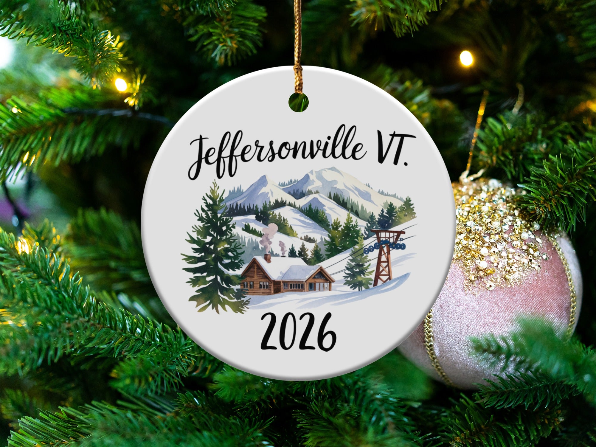 Jeffersonville VT 2026 ceramic ornament with snowy mountains and ski lift.