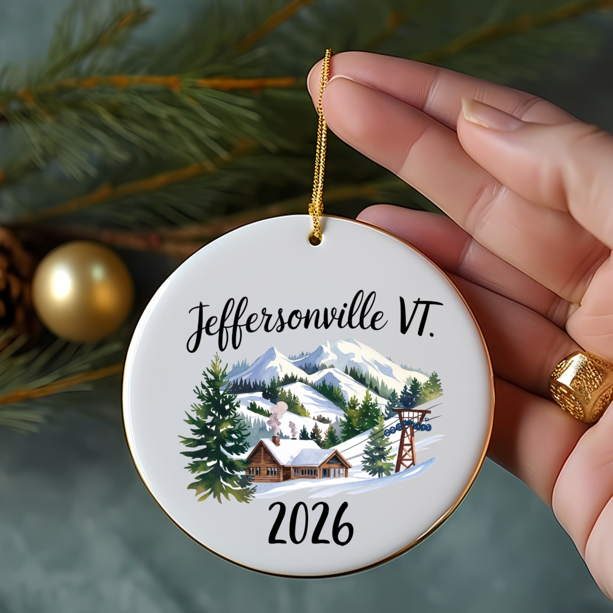 Jeffersonville VT 2026 ornament with snowy mountains, trees, and ski lift.