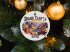 Grand Canyon 2026 round ceramic ornament on a Christmas tree.