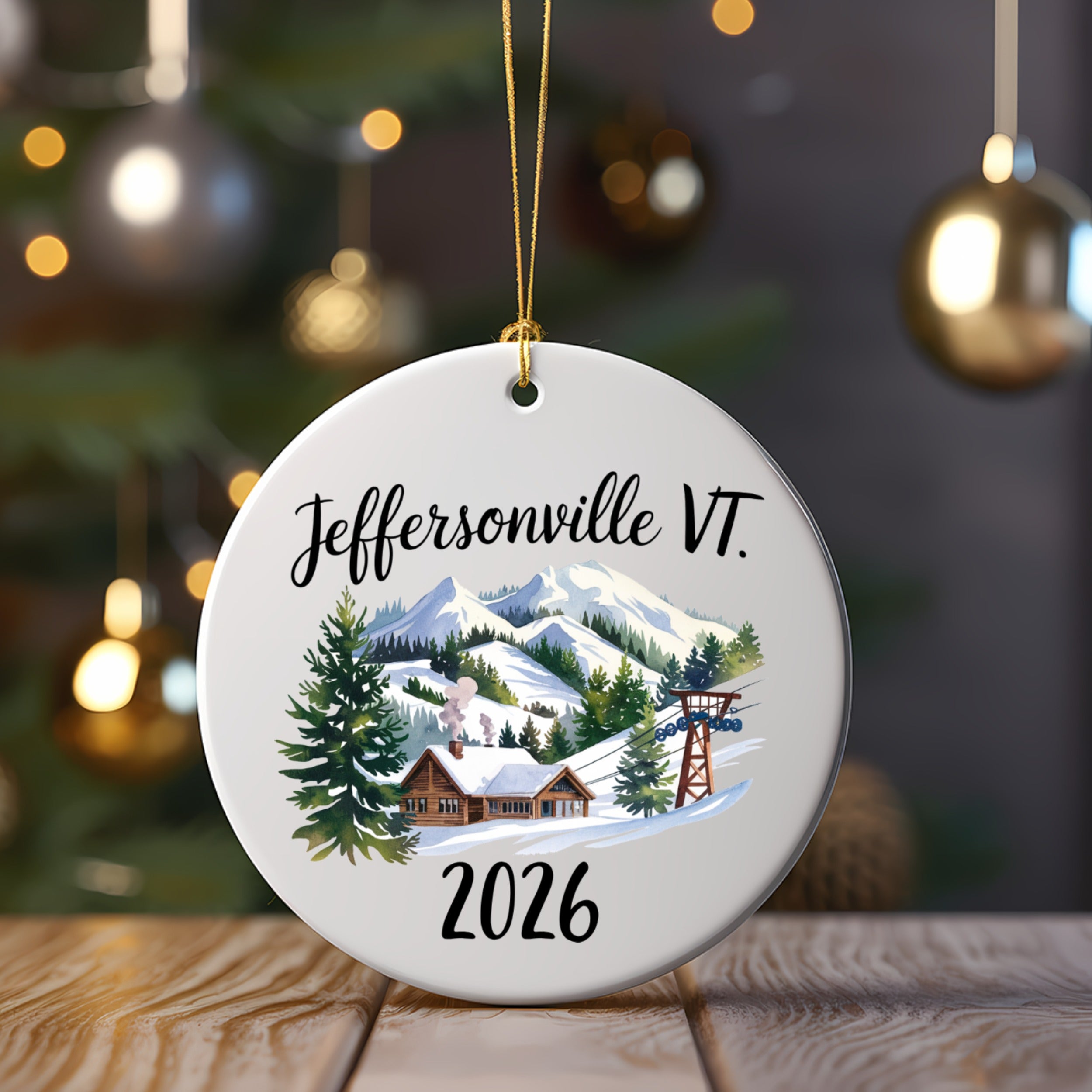 Christmas ornament with a snowy village, ski lift, and "Jeffersonville VT. 2026" text.