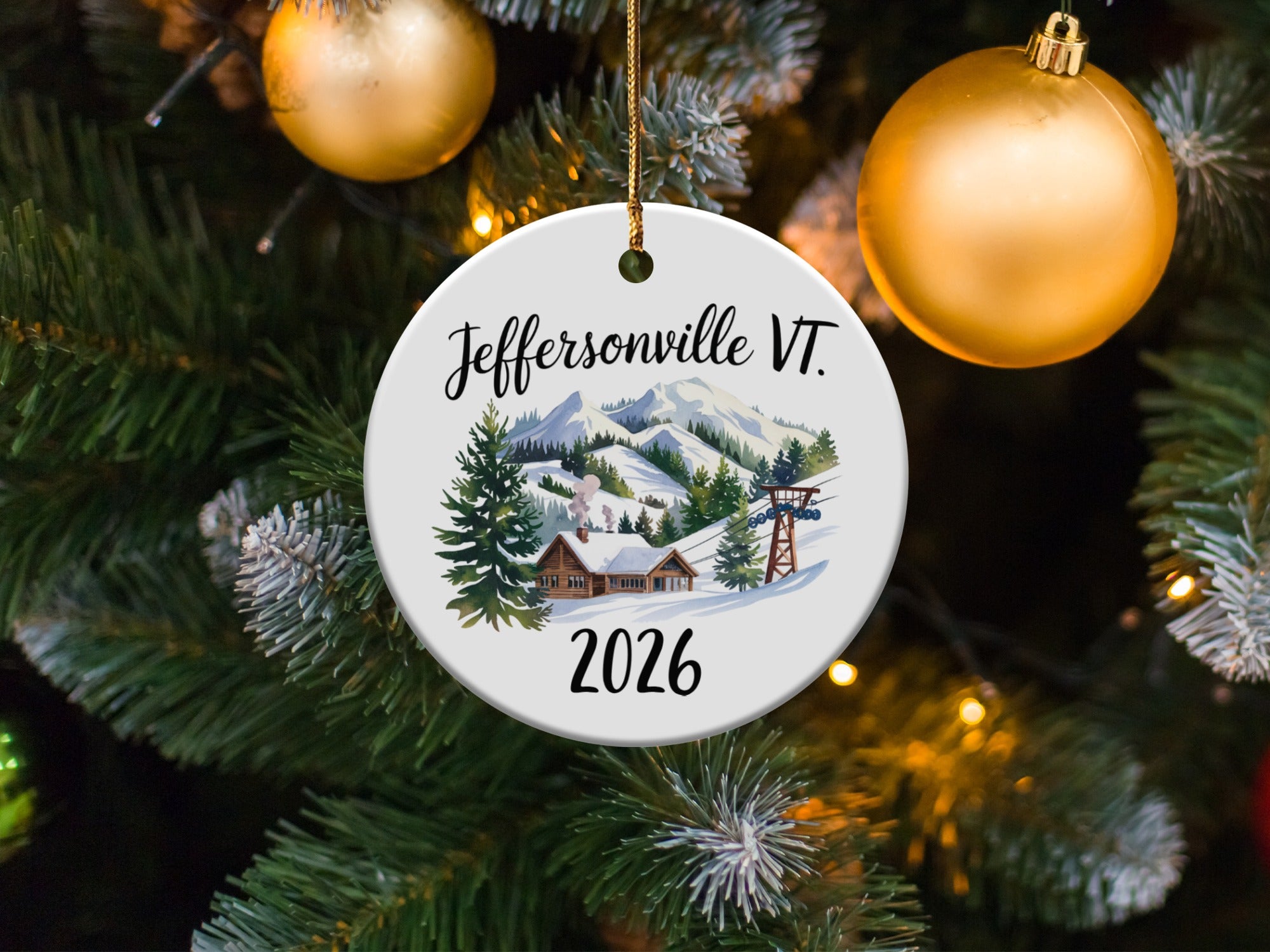 Jeffersonville VT 2026 ceramic ornament with snowy mountains and ski lift.