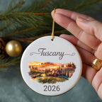 Round ornament with "Tuscany 2026" and watercolor landscape.