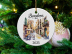 Round ceramic ornament depicting a Barcelona street scene and "2025."