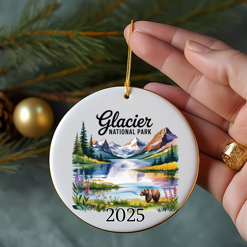 Glacier National Park 2025 ornament with lake, mountains, trees, and bear.