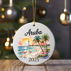 Round ornament with Aruba 2025, flamingos, palm trees, and lighthouse.