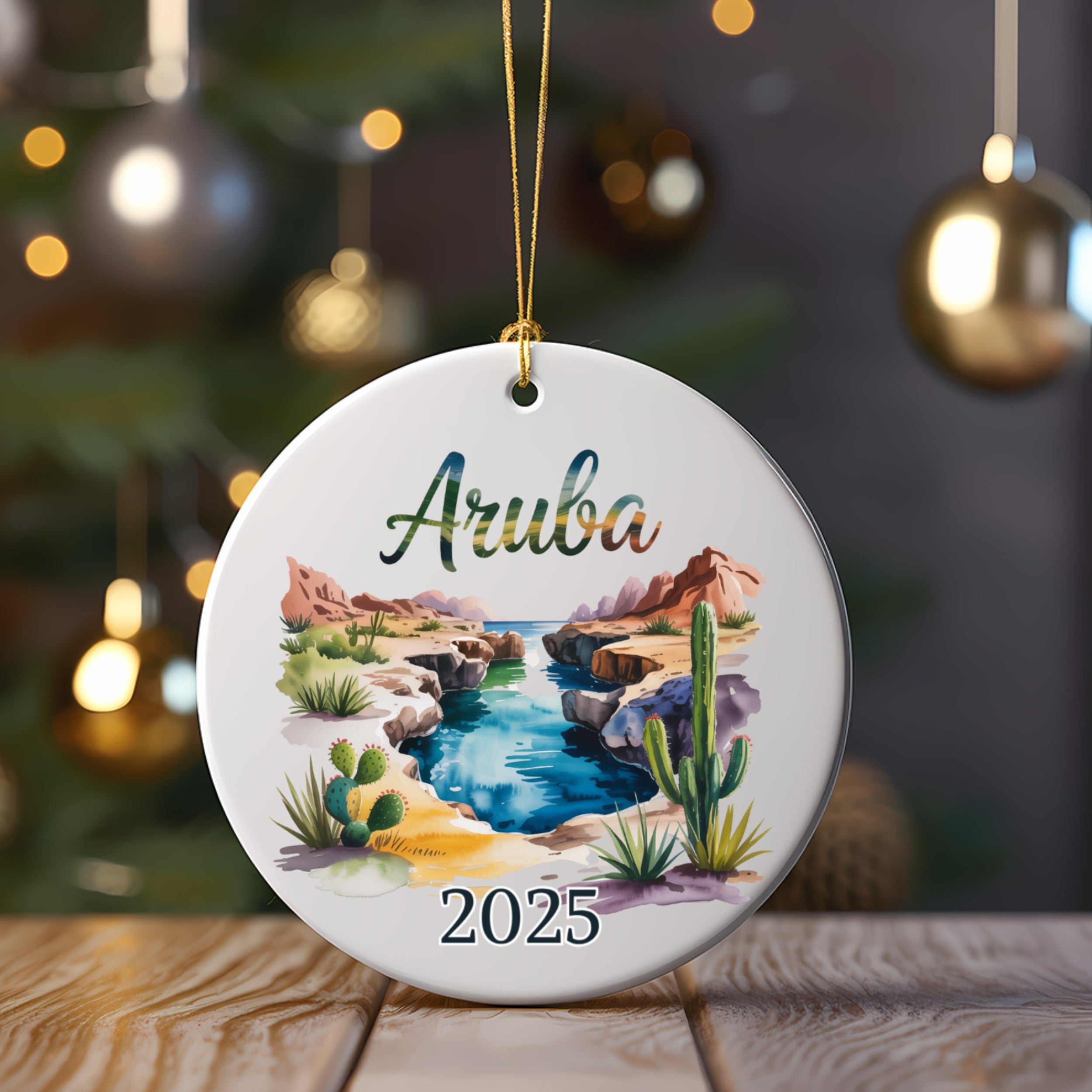 Round Aruba ornament with desert landscape and 2025 date.