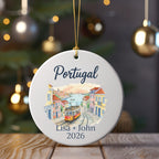Christmas ornament with "Portugal" and "Lisa + John 2026" above a tram scene.