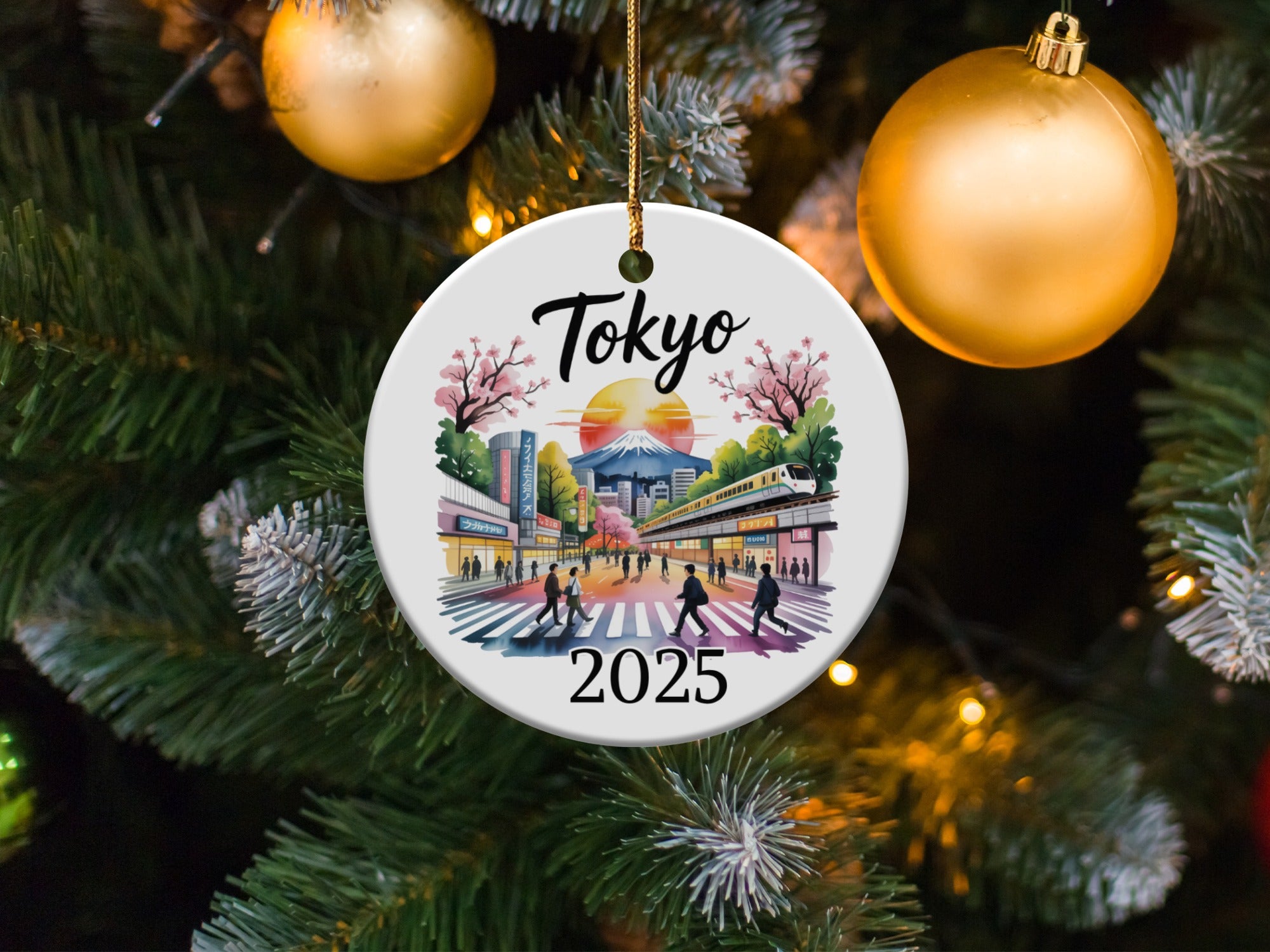 Tokyo 2025 ornament with cityscape, cherry blossoms, and snow-capped mountains.