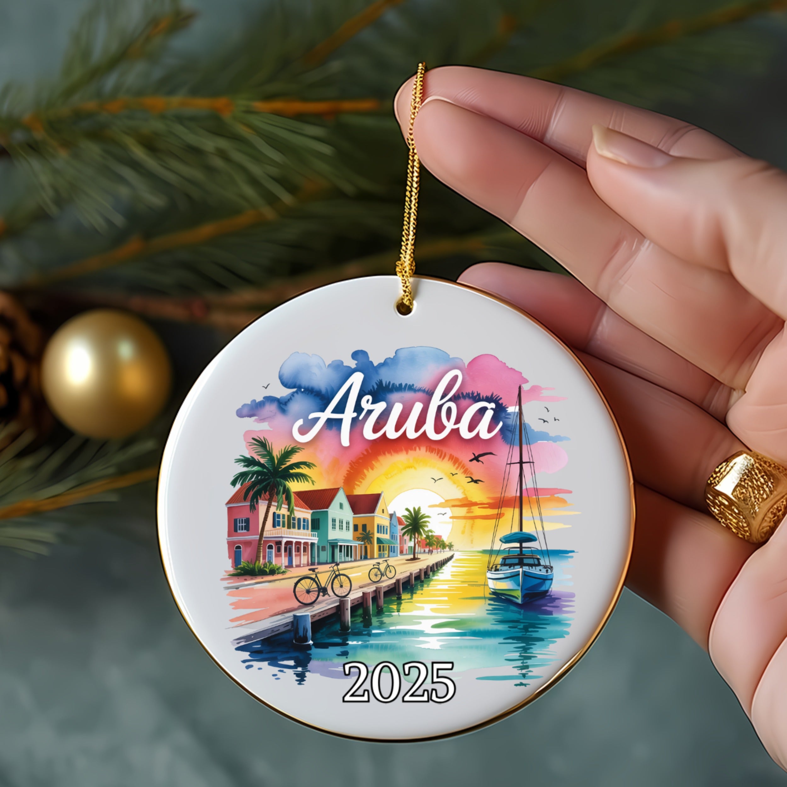 Aruba 2025 ornament with colorful beach scene, sailboats, and palm trees.