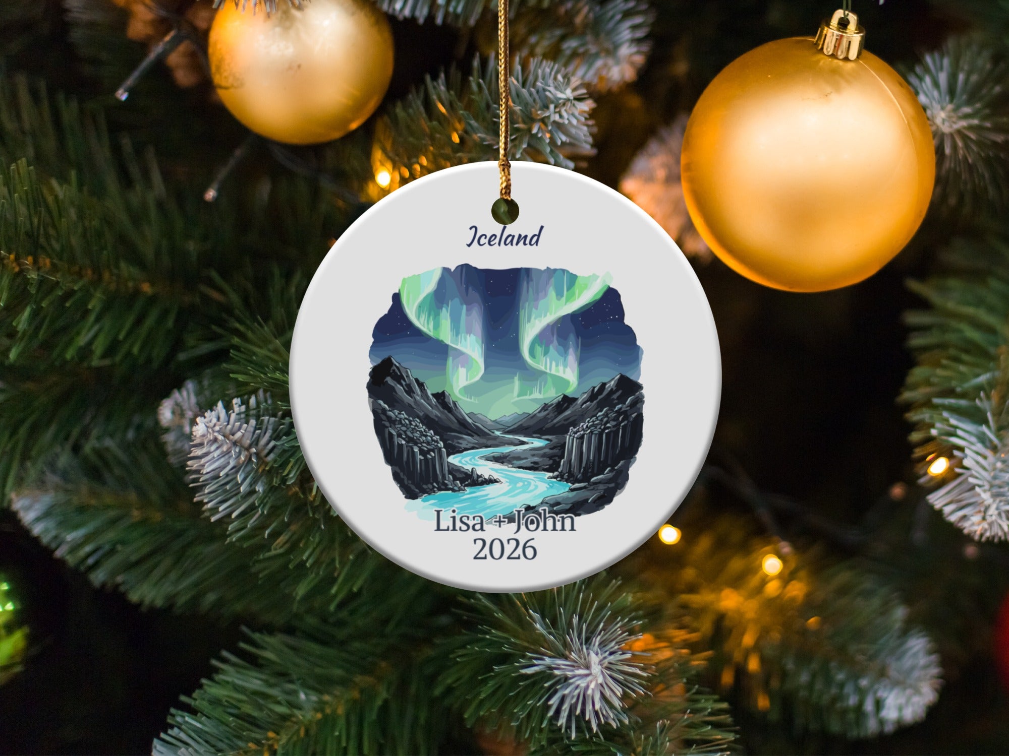 Round ceramic ornament with Iceland aurora borealis scene and custom names.