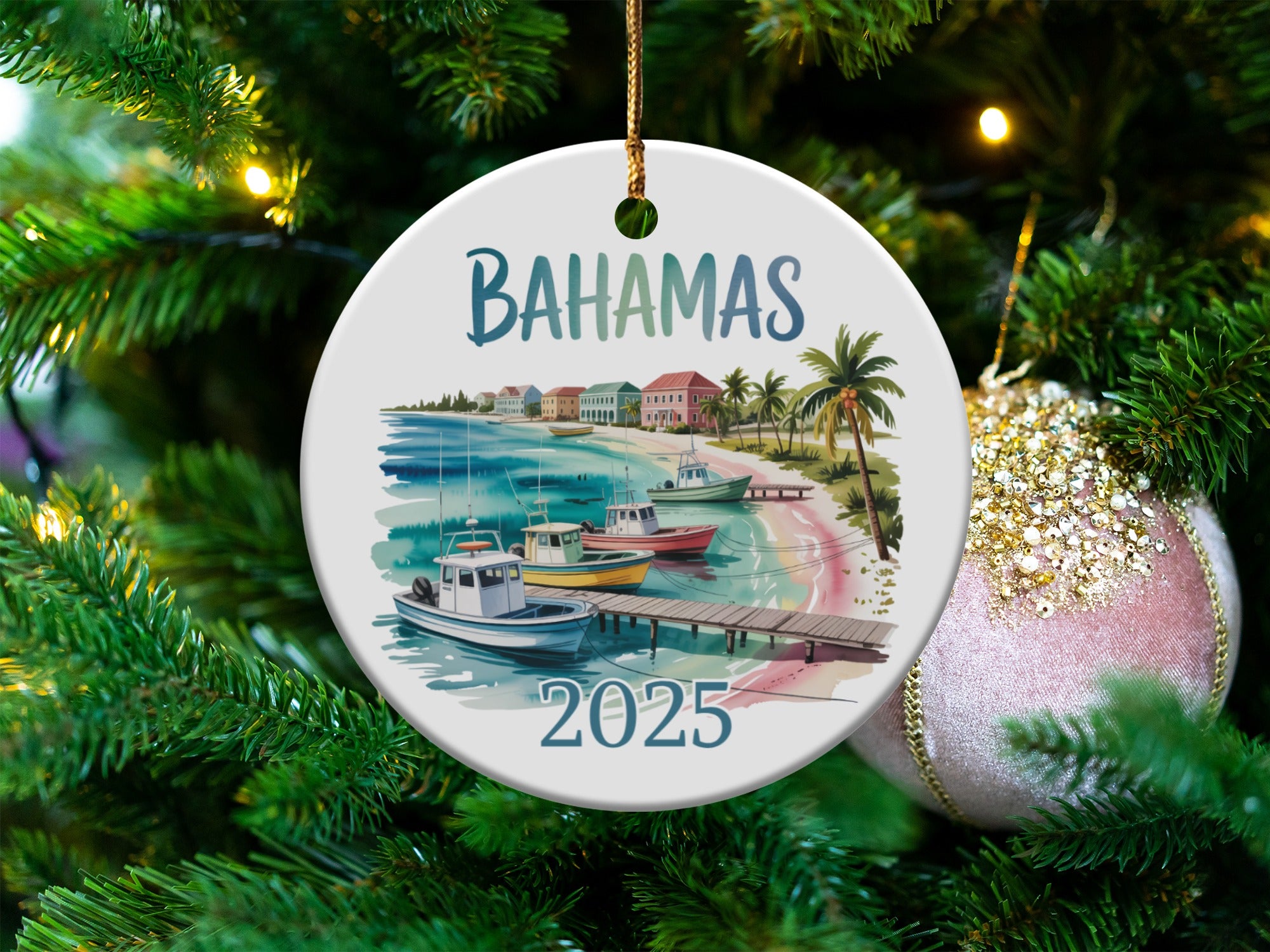 Bahamas Christmas ornament with boats, pier, and buildings on a beach.