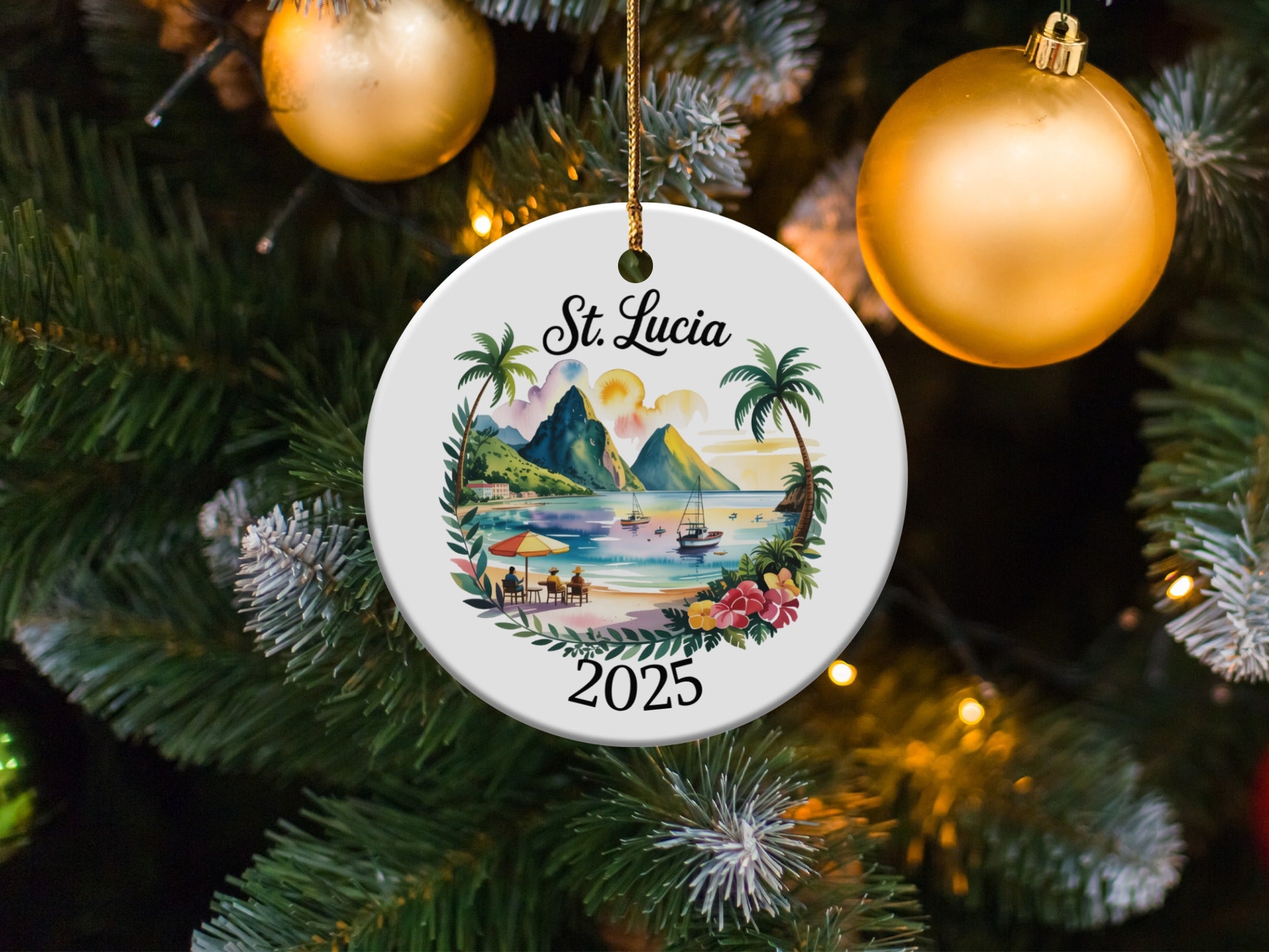 Round St. Lucia 2025 Christmas ornament depicting a beach scene with boats.