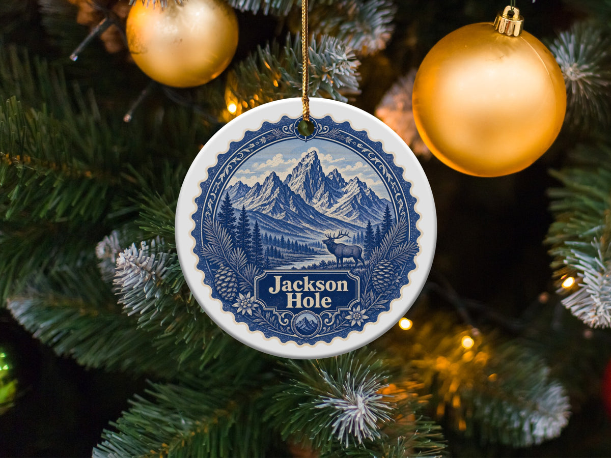 Jackson Hole scenic round ornament with elk and mountains on Christmas tree.