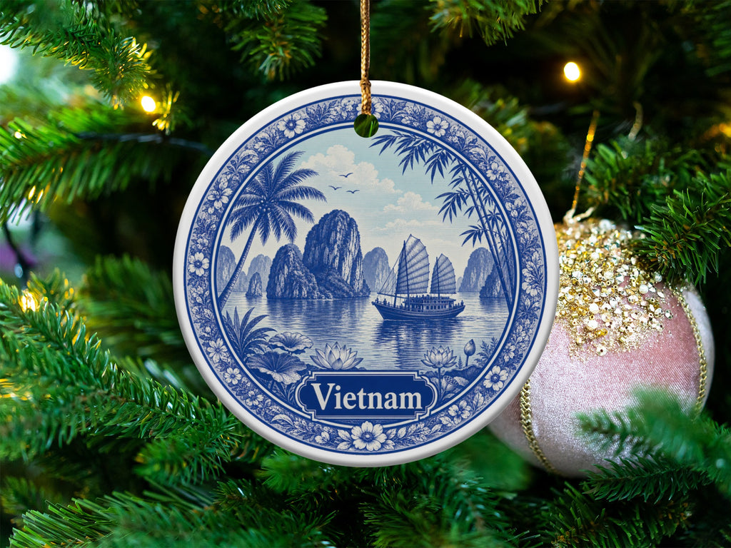 Round ceramic ornament with blue and white Vietnam landscape and text.
