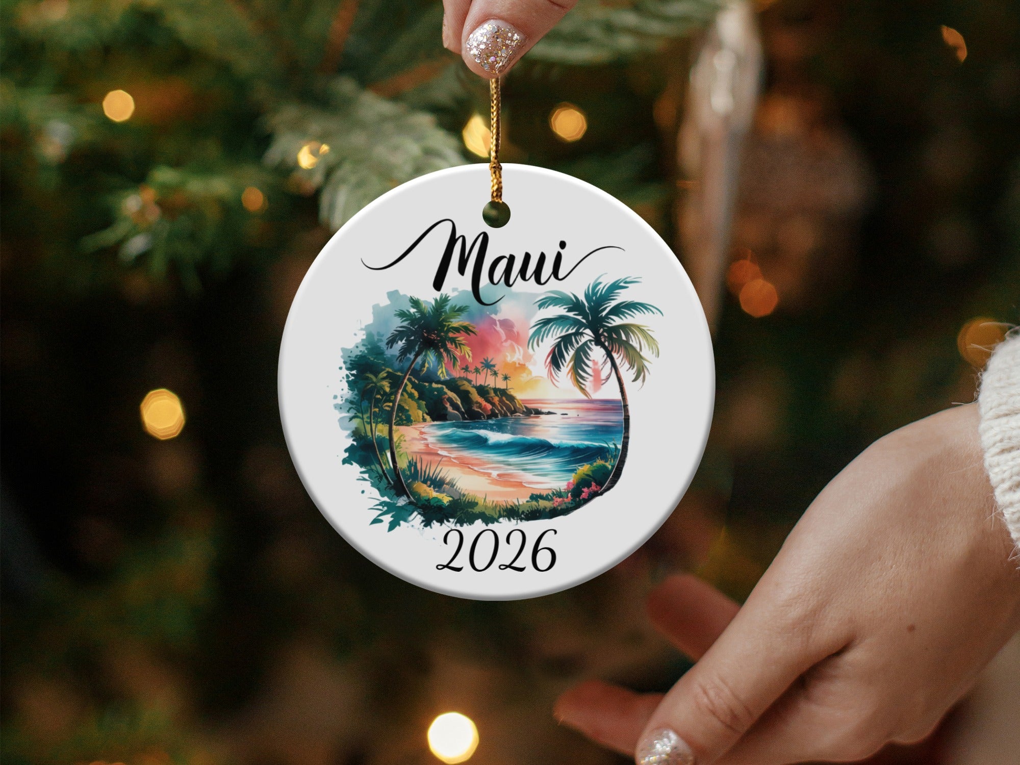 Circular ornament with tropical Maui scene and "Maui 2026" text.