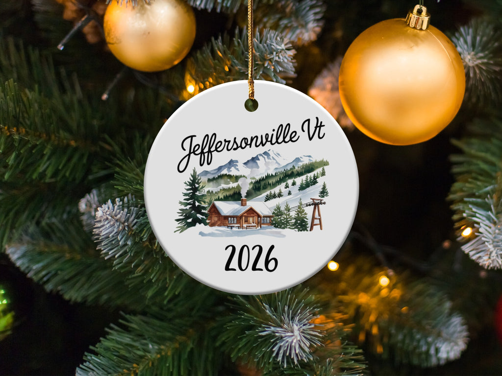 Round ornament with Jeffersonville VT 2026 and mountain scene.