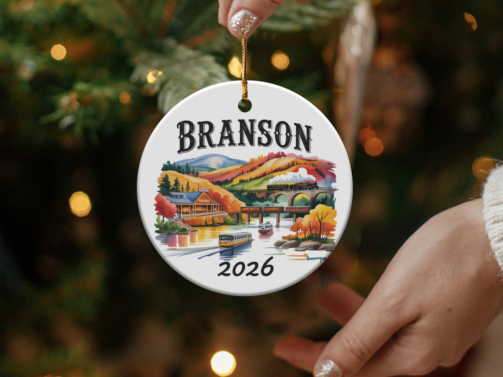 Branson 2026 ceramic ornament with train and colorful buildings.