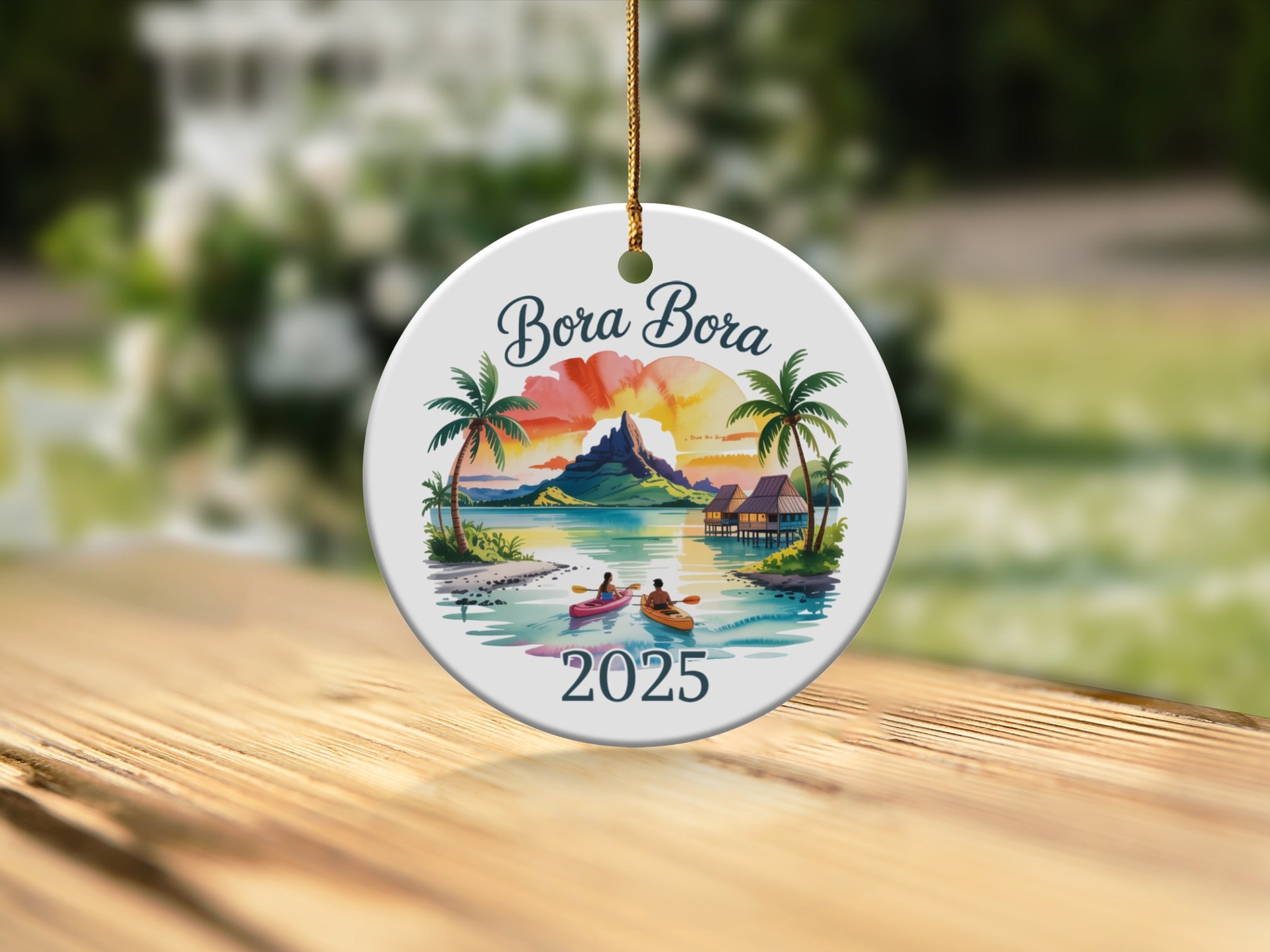 Round Bora Bora ornament with palm trees, kayaks, and "2025" text.