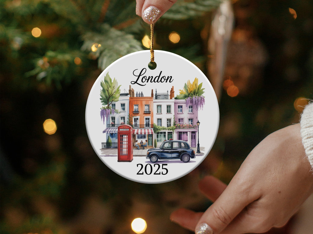 Round London ornament with buildings, phone booth, and car, dated 2025.