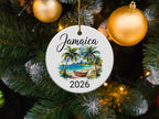 Round Jamaica 2026 ornament with beach scene and palm trees.