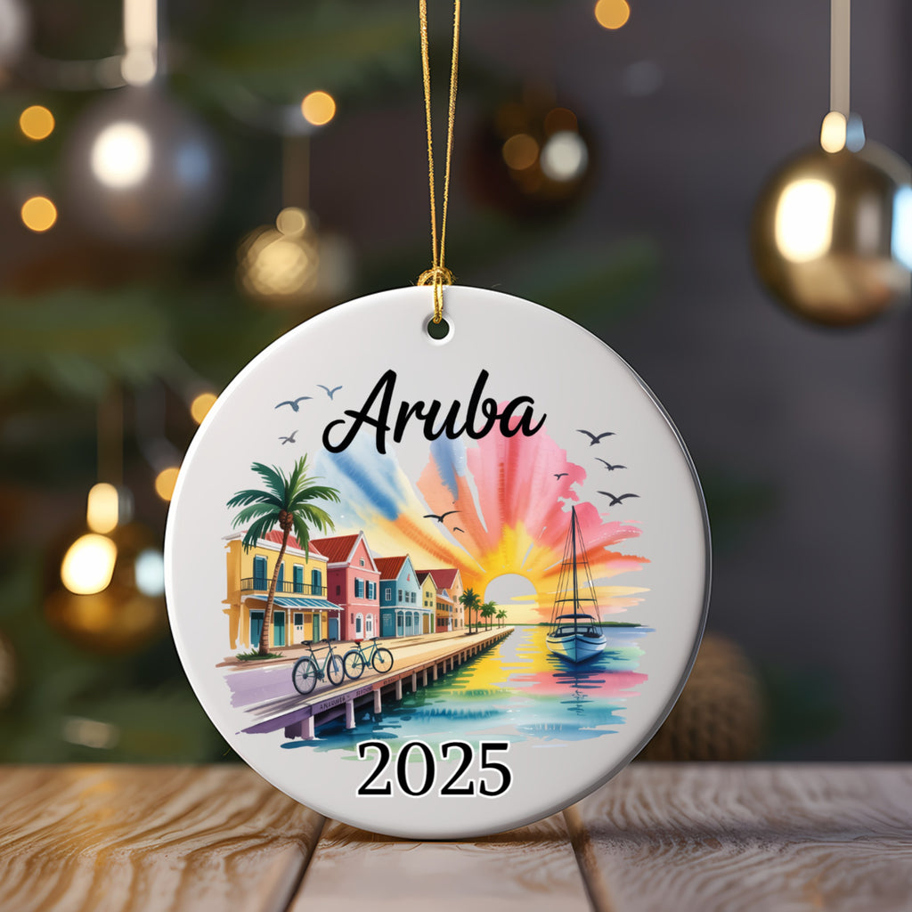 Round ornament with "Aruba 2025" and colorful beach scene.