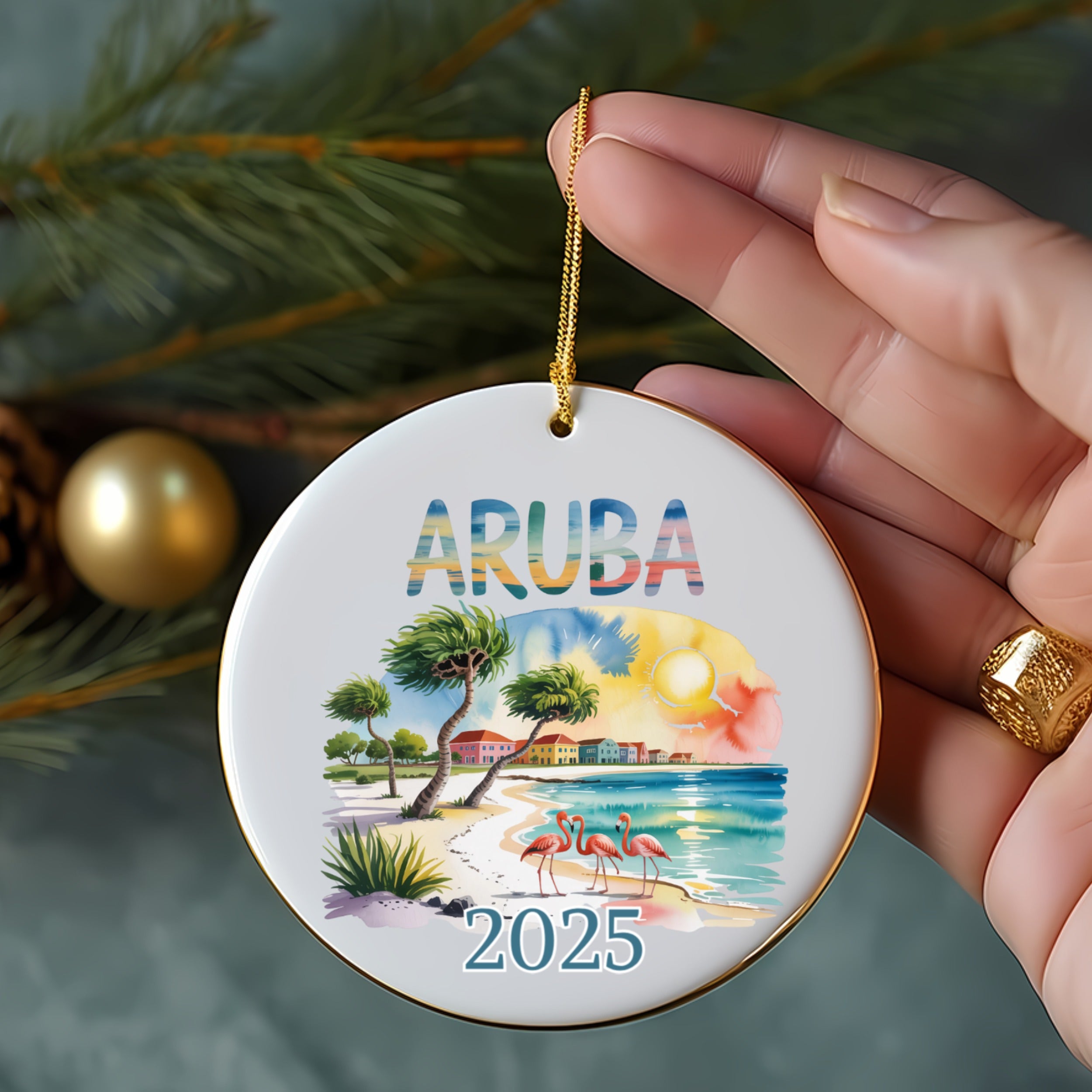 Round ornament with "ARUBA 2025" text, palm trees, and flamingos on beach.