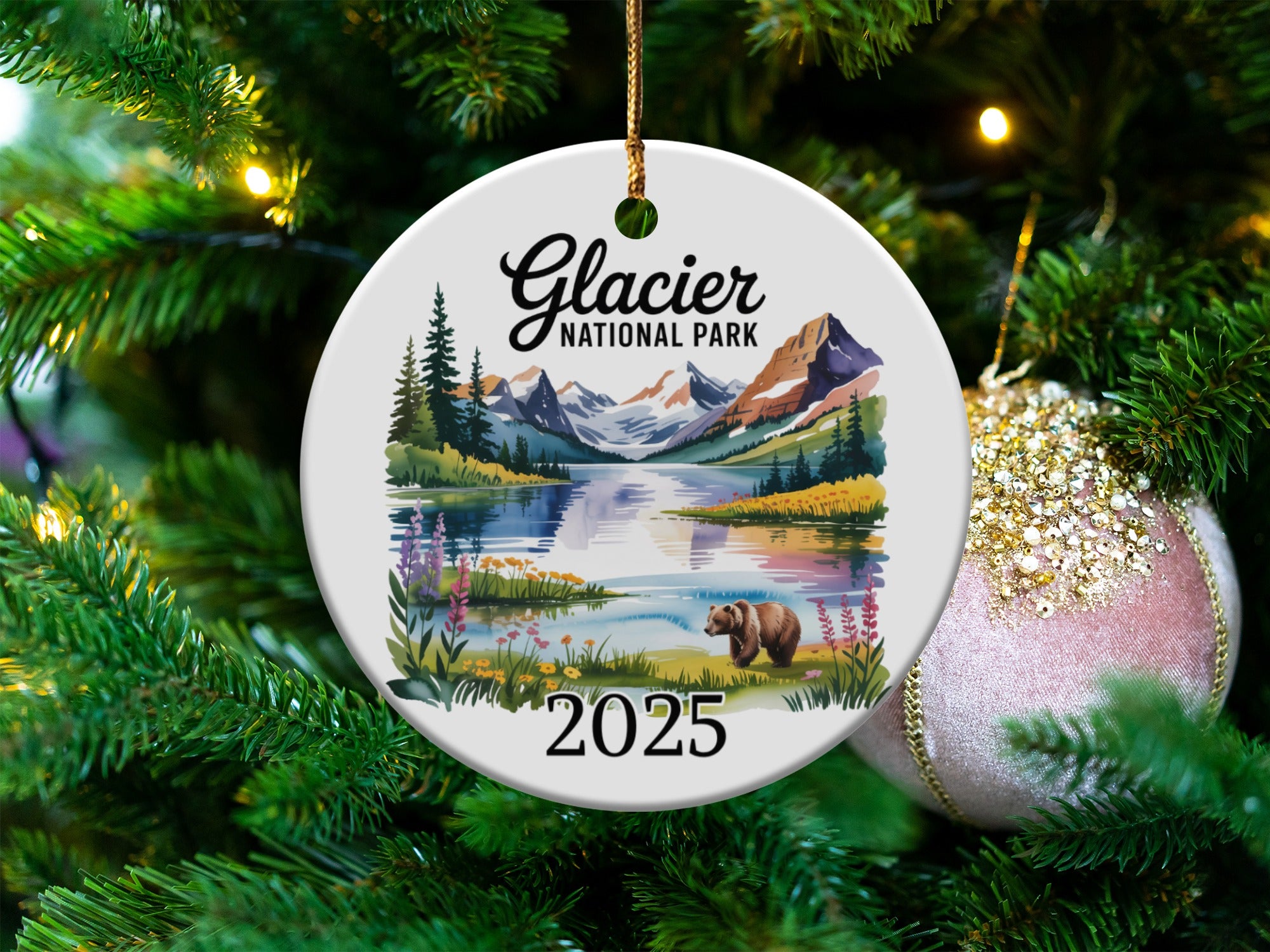 Glacier National Park 2025 ornament featuring a bear by a lake with mountains.
