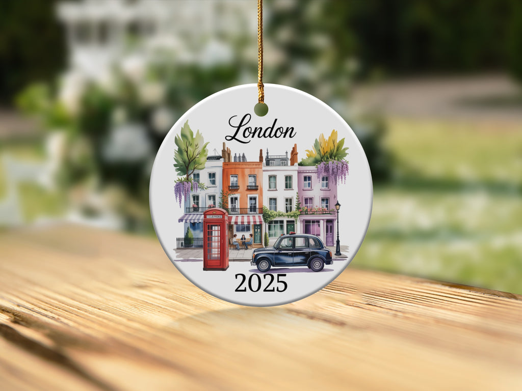 Ceramic ornament depicting London row houses, red phone booth, and car, with "London 2025" text.