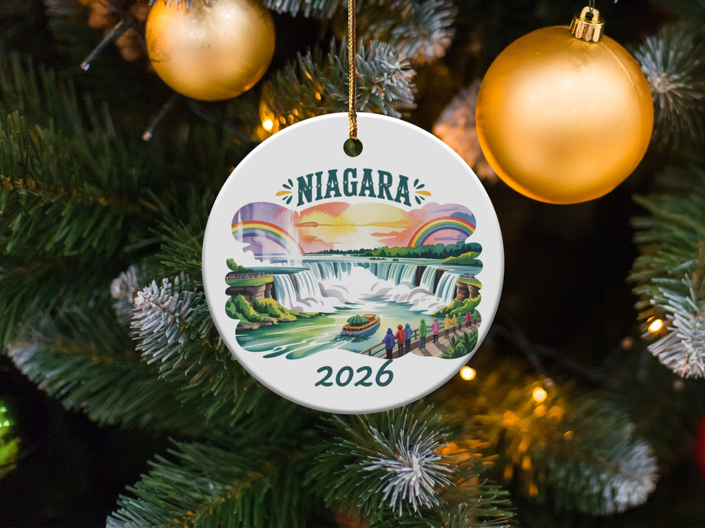 Niagara Falls 2026 ceramic ornament with colorful illustration hanging on a Christmas tree.