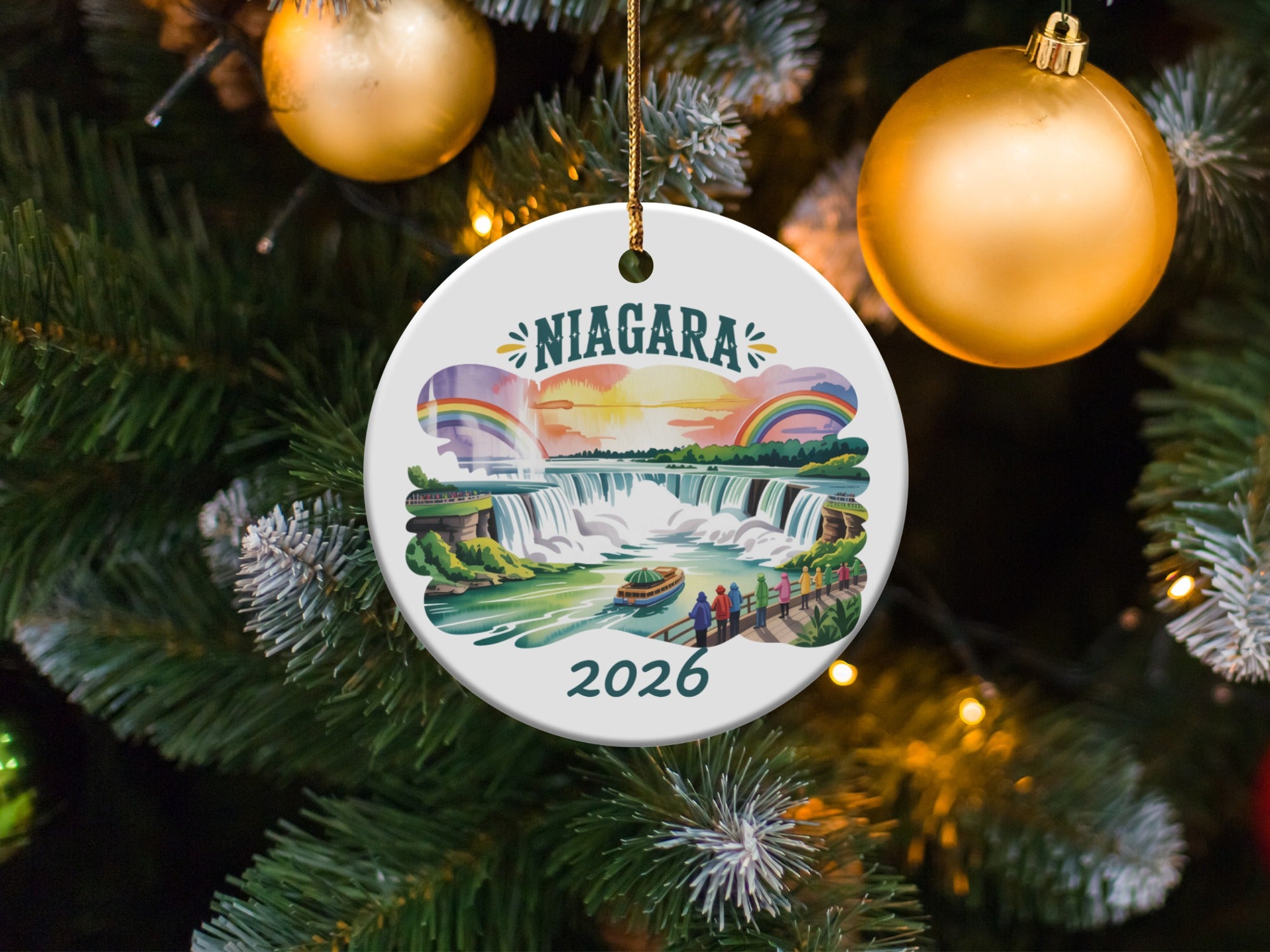 Niagara Falls 2026 ceramic ornament with colorful illustration hanging on a Christmas tree.