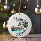 Round ornament with "Maldives 2026" and watercolor overwater bungalows.
