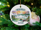 Niagara Falls ornament on a Christmas tree with text "Niagara 2026".