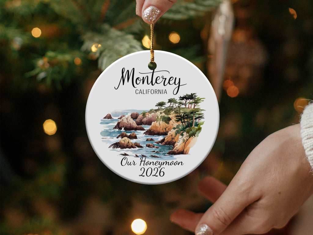Round ceramic ornament with Monterey, California coastline and "Our Honeymoon 2026".