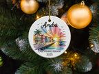 Aruba honeymoon ornament with sailboat and colorful buildings at sunset.