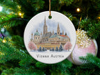Circular ornament featuring a watercolor of Vienna, Austria skyline.