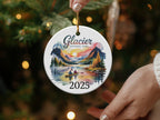 Glacier National Park ornament with a lake, mountains, and a canoe, dated 2025.