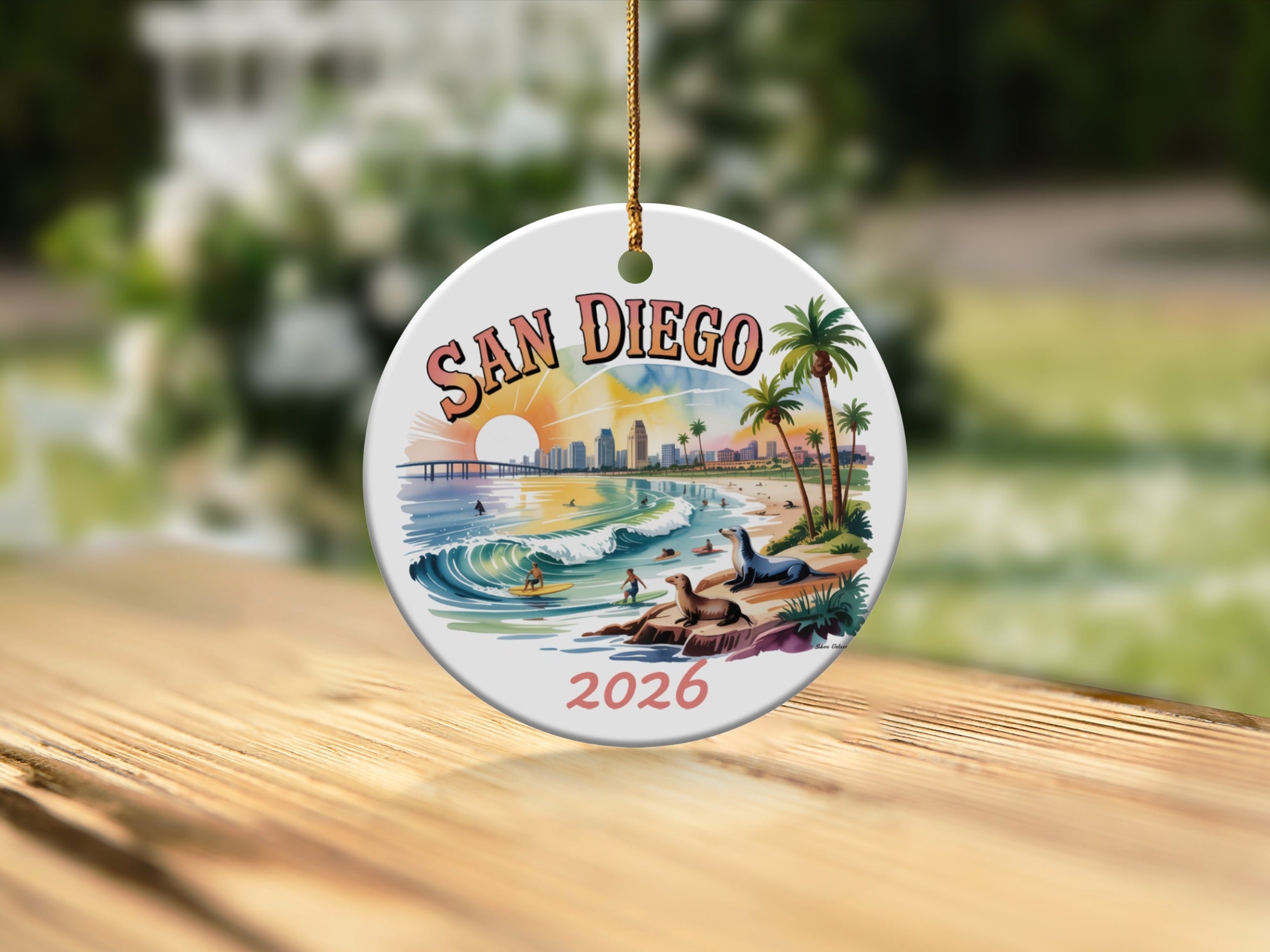 San Diego 2026 ceramic ornament featuring surf, seals, and cityscape.