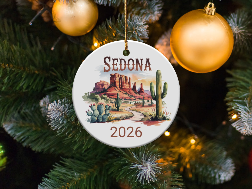 Round ornament depicting Sedona, Arizona landscape with "SEDONA 2026" text.