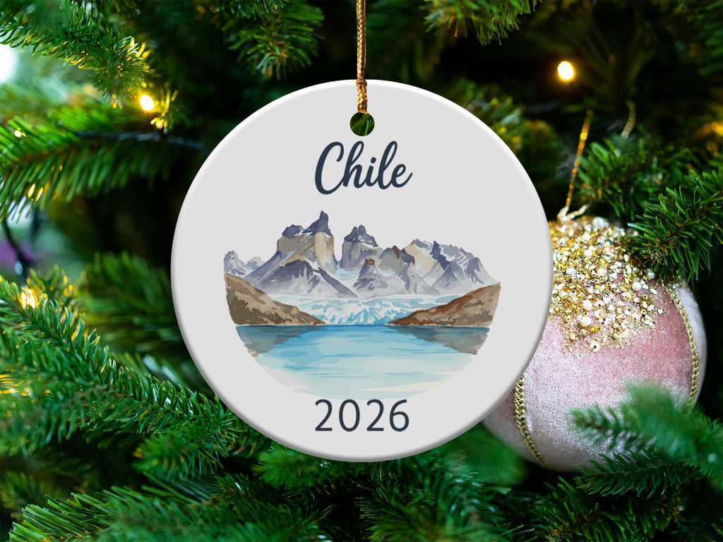 Round ceramic ornament featuring Chile's mountains and glaciers with "Chile" and "2026".