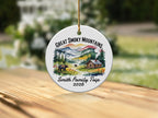 Round ornament with "Great Smoky Mountains Smith Family Trip 2026" and scenic mountain cabin art.