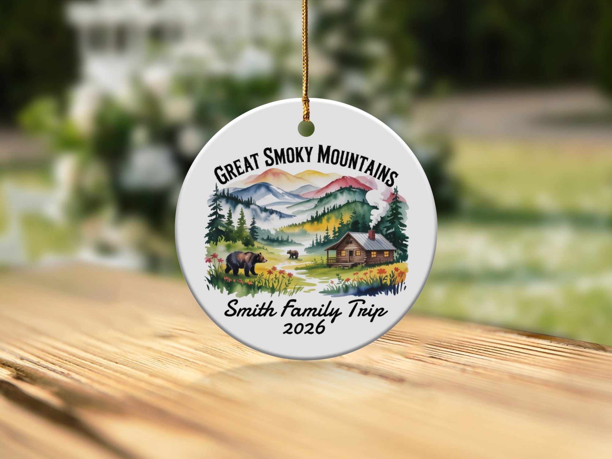 Round ornament with "Great Smoky Mountains Smith Family Trip 2026" and scenic mountain cabin art.