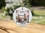 Round ornament depicting Tower Bridge in London with a double-decker bus.