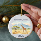 Ornament depicting Mount Kilimanjaro, a giraffe, and acacia tree, dated 2026.