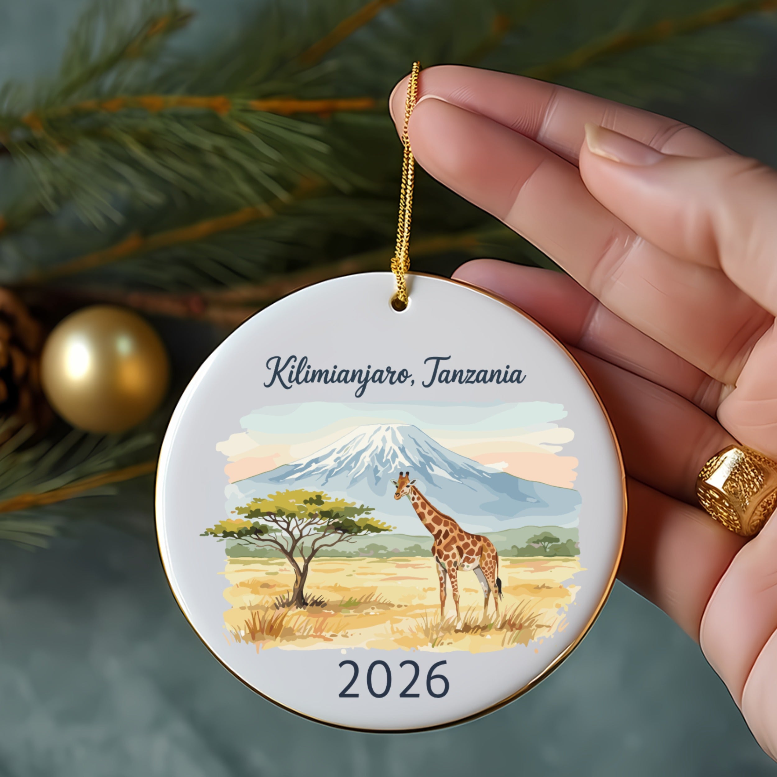 Ornament depicting Mount Kilimanjaro, a giraffe, and acacia tree, dated 2026.