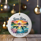 Bora Bora 2025 ornament with sunset, boats, and palm trees over water.