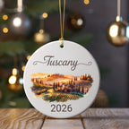 Round ornament with "Tuscany" and "2026" text above a Tuscan landscape.
