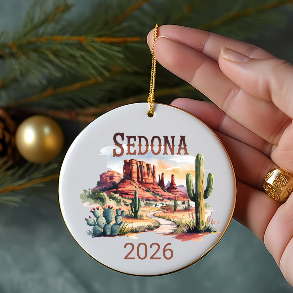 Round Sedona ornament with desert landscape, cactus, and "2026".