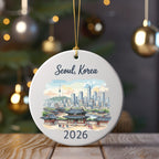 Round ceramic ornament with Seoul, Korea skyline and "2026" date.