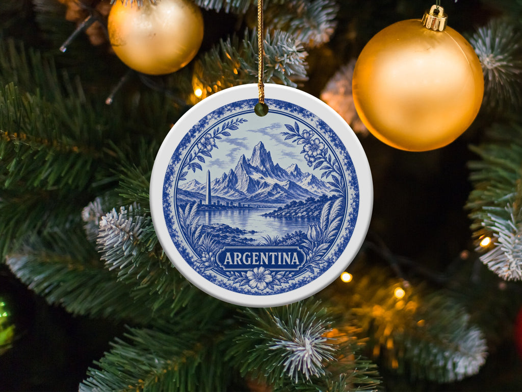 Round ornament with blue and white design of mountains, lake, and city, labeled "ARGENTINA".